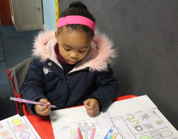 Child coloring at Canival Kids Private Preschool